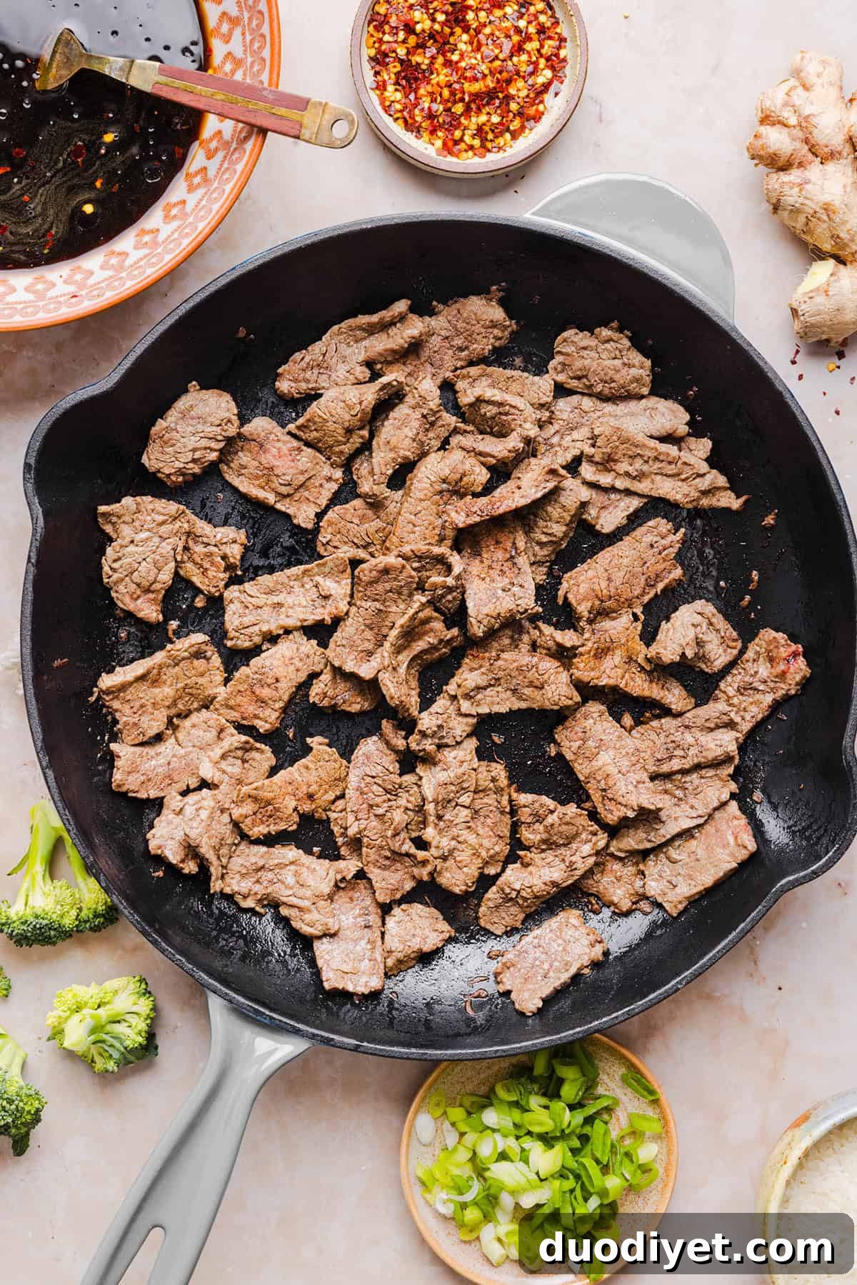 You'll love this Healthy Beef and Broccoli recipe made with tender flank steak, crisp broccoli and a savory garlic ginger sauce.  A quick and easy weeknight dinner that tastes better than take-out and comes together in under 30 minutes!