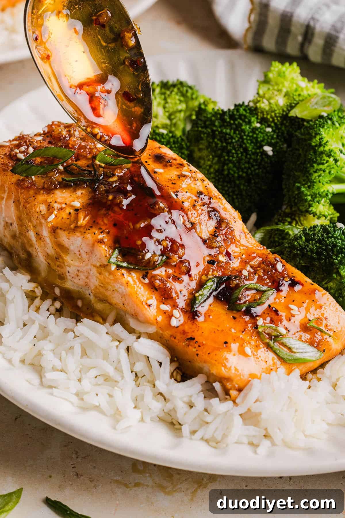 Hot Honey Glazed Salmon - tender, flaky, coated in a sweet and savory hot honey sauce