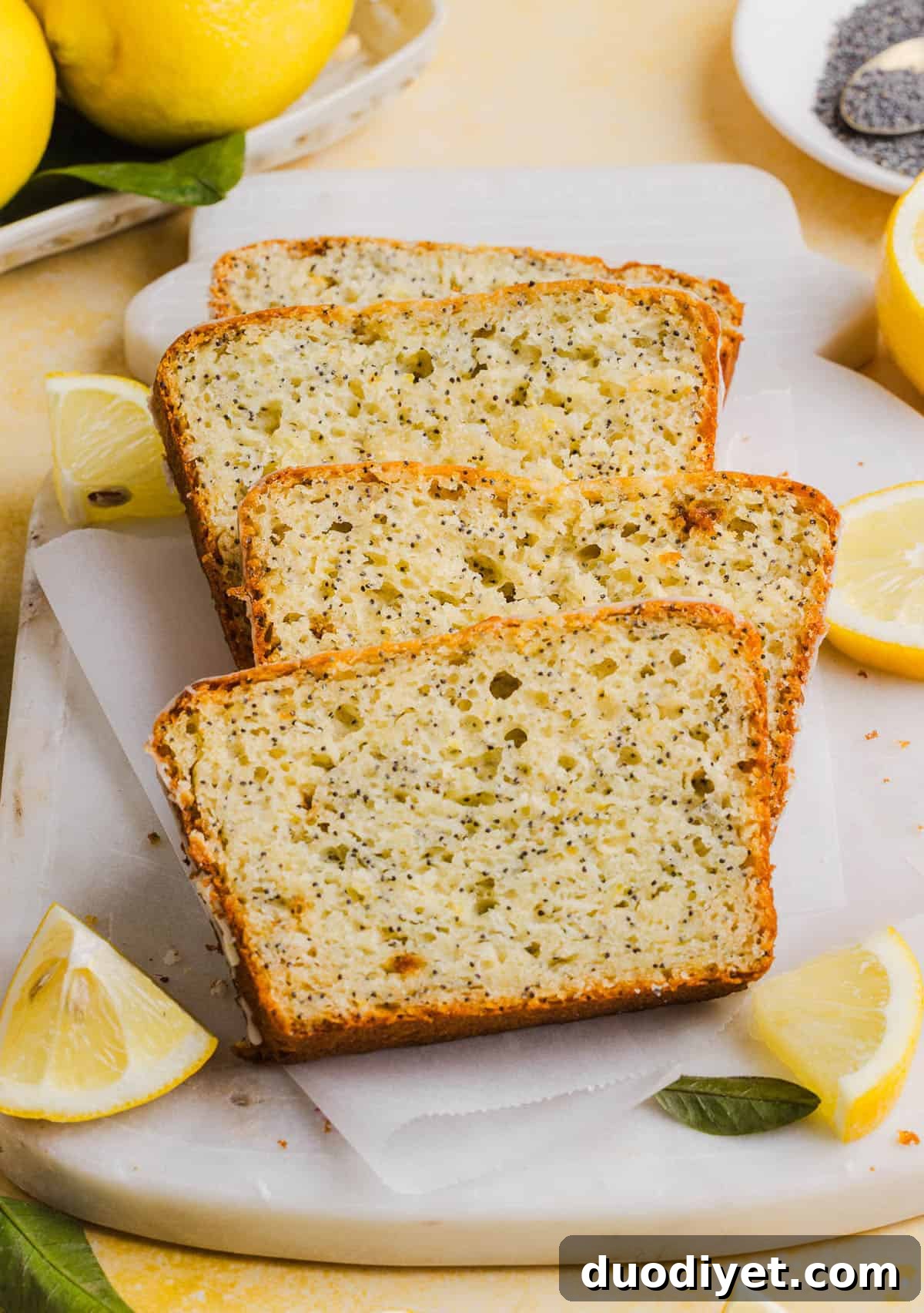 The BEST Healthy Lemon Poppy Seed Bread made with Greek yogurt and honey. Perfectly moist, naturally sweetened, and topped with the most delicious fresh lemon glaze!