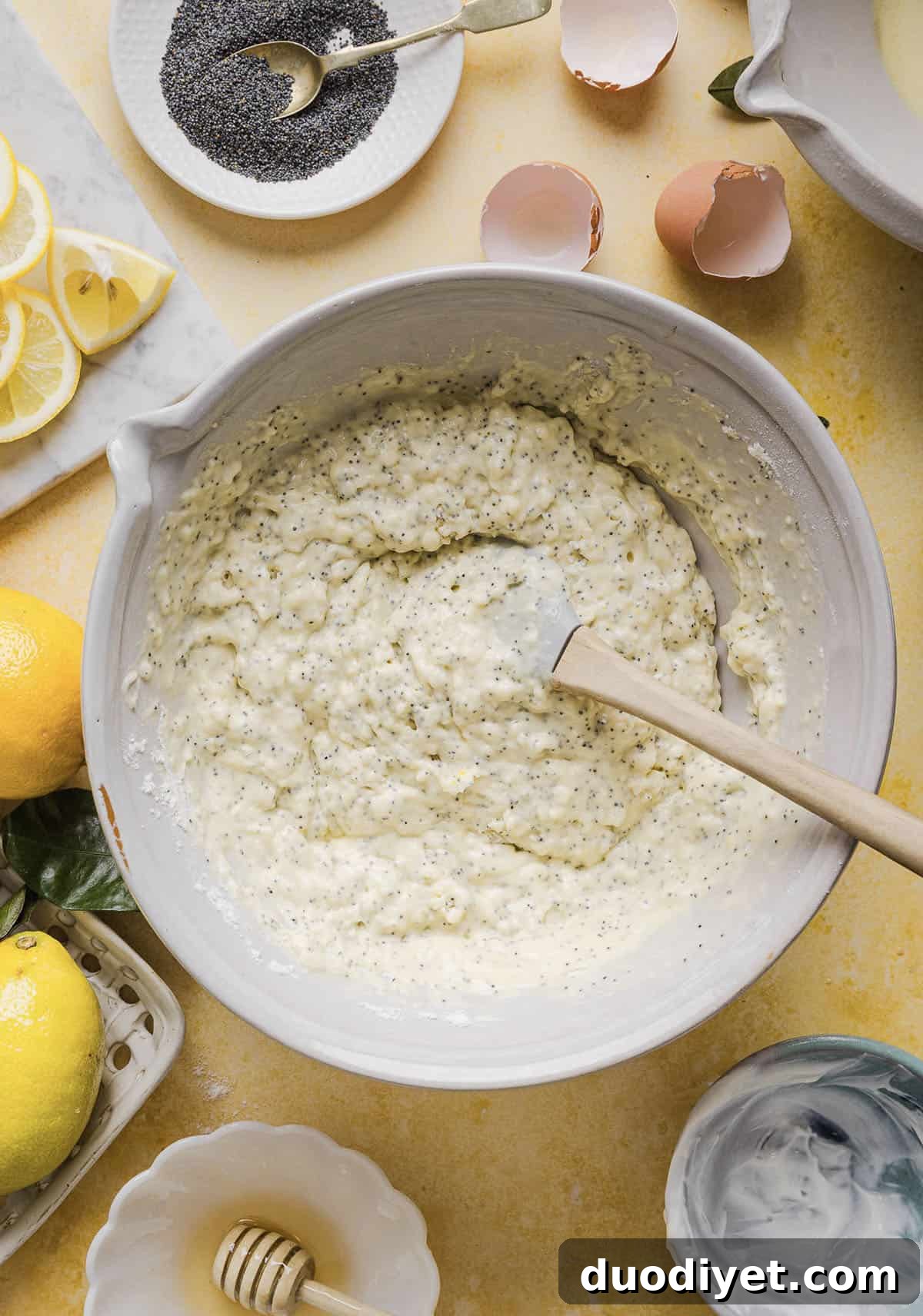 The BEST Healthy Lemon Poppy Seed Bread made with Greek yogurt and honey. Perfectly moist, naturally sweetened, and topped with the most delicious fresh lemon glaze!