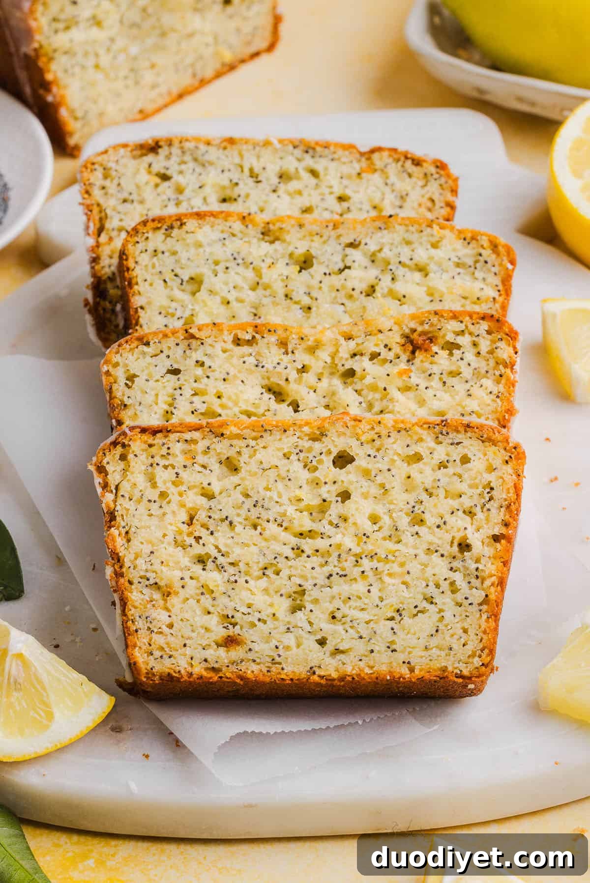The BEST Healthy Lemon Poppy Seed Bread made with Greek yogurt and honey. Perfectly moist, naturally sweetened, and topped with the most delicious fresh lemon glaze!