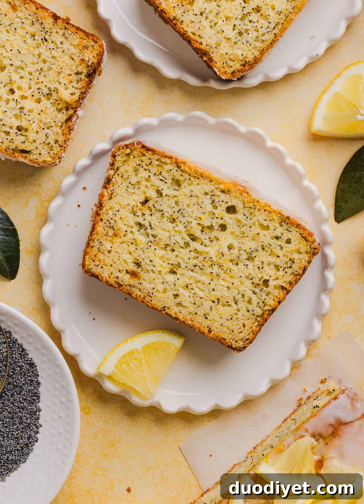 The BEST Healthy Lemon Poppy Seed Bread made with Greek yogurt and honey. Perfectly moist, naturally sweetened, and topped with the most delicious fresh lemon glaze!