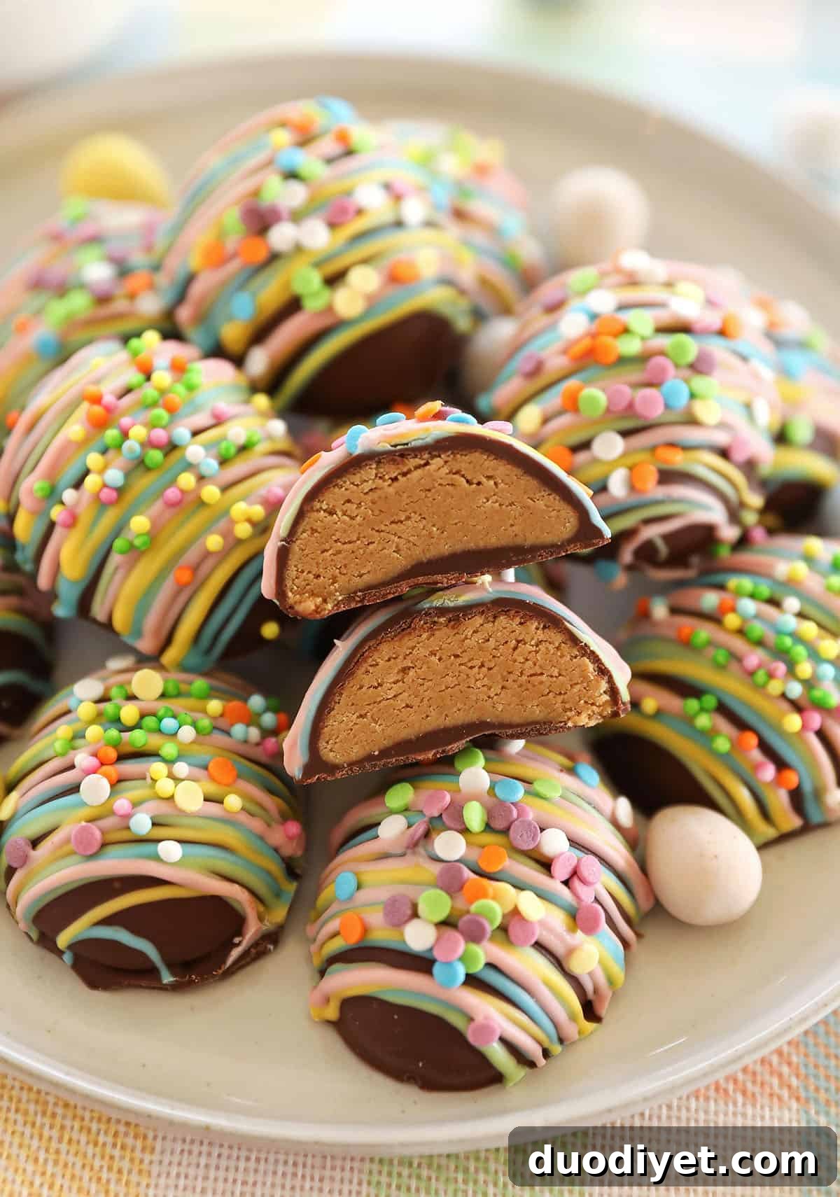 Chocolate dipped peanut butter eggs chilled on a tray
