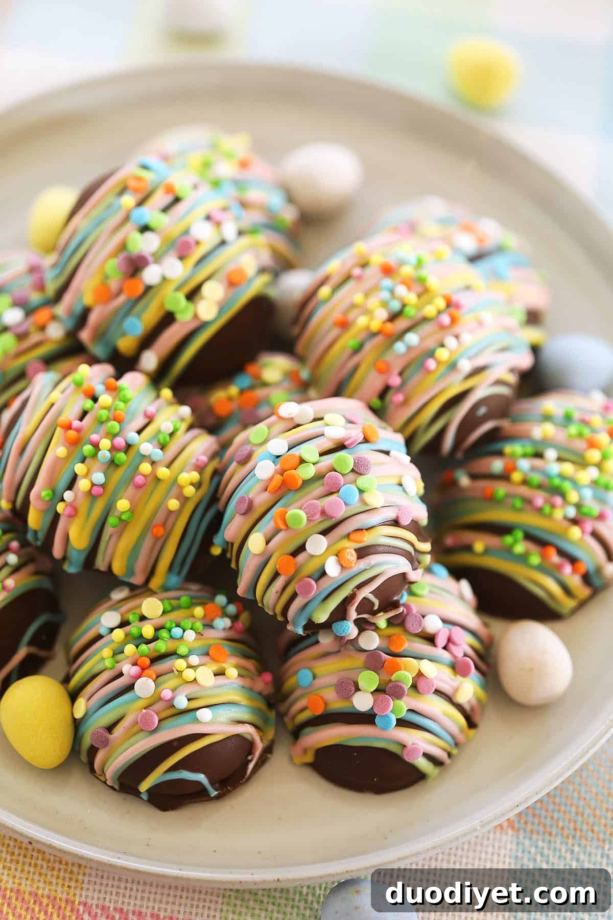 Decorated peanut butter eggs arranged on parchment