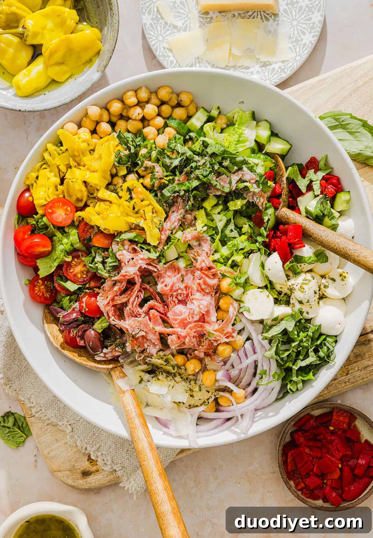 Classic Italian Chopped Salad with Zesty Vinaigrette 2 This Italian Chopped Salad tastes just like your favorite grinder, but lighter and SO good! Loaded with crisp lettuce, savory salami, chickpeas, fresh veggies and the best homemade dressing, all chopped up so you get the perfect bite every time!