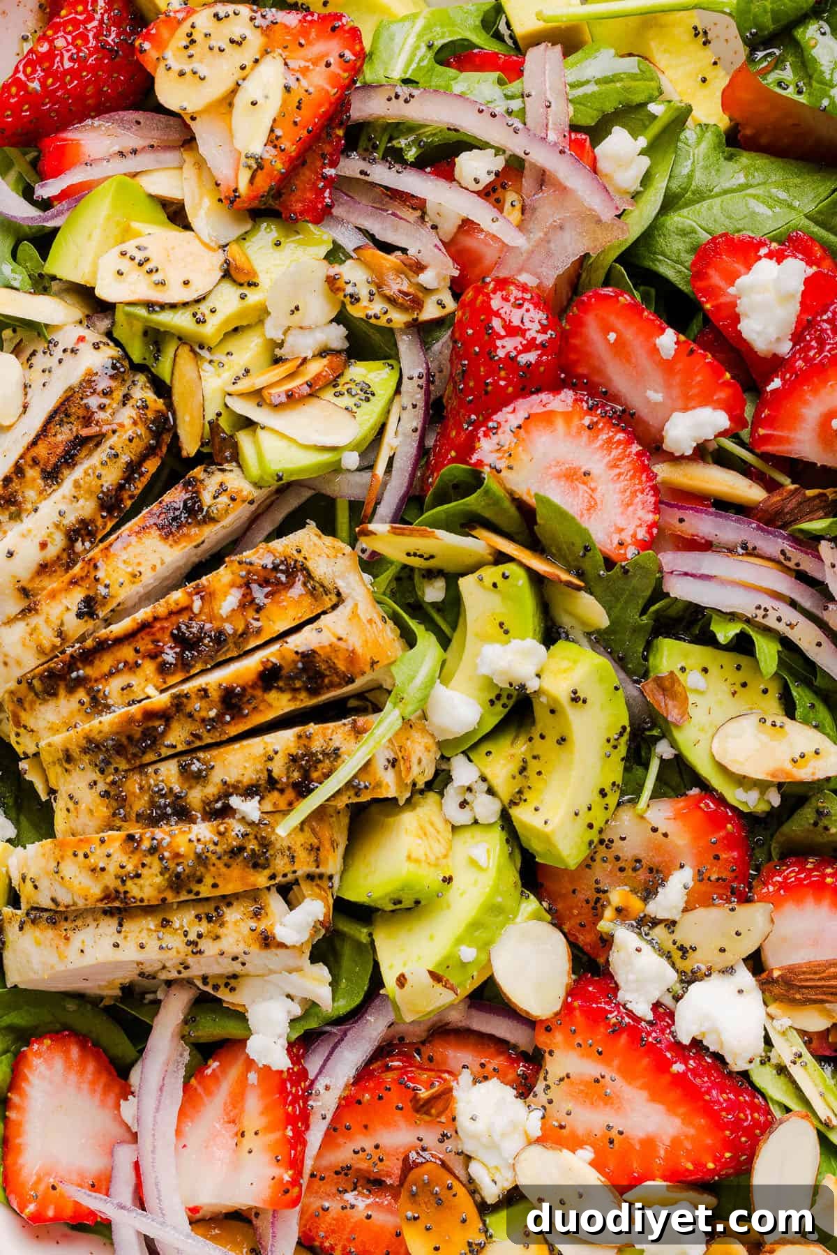 This Strawberry Poppy Seed Chicken Salad is fresh, flavorful, and perfect for spring and summer! Made with juicy strawberries, tender chicken, crunchy toppings, and the BEST poppy seed dressing.