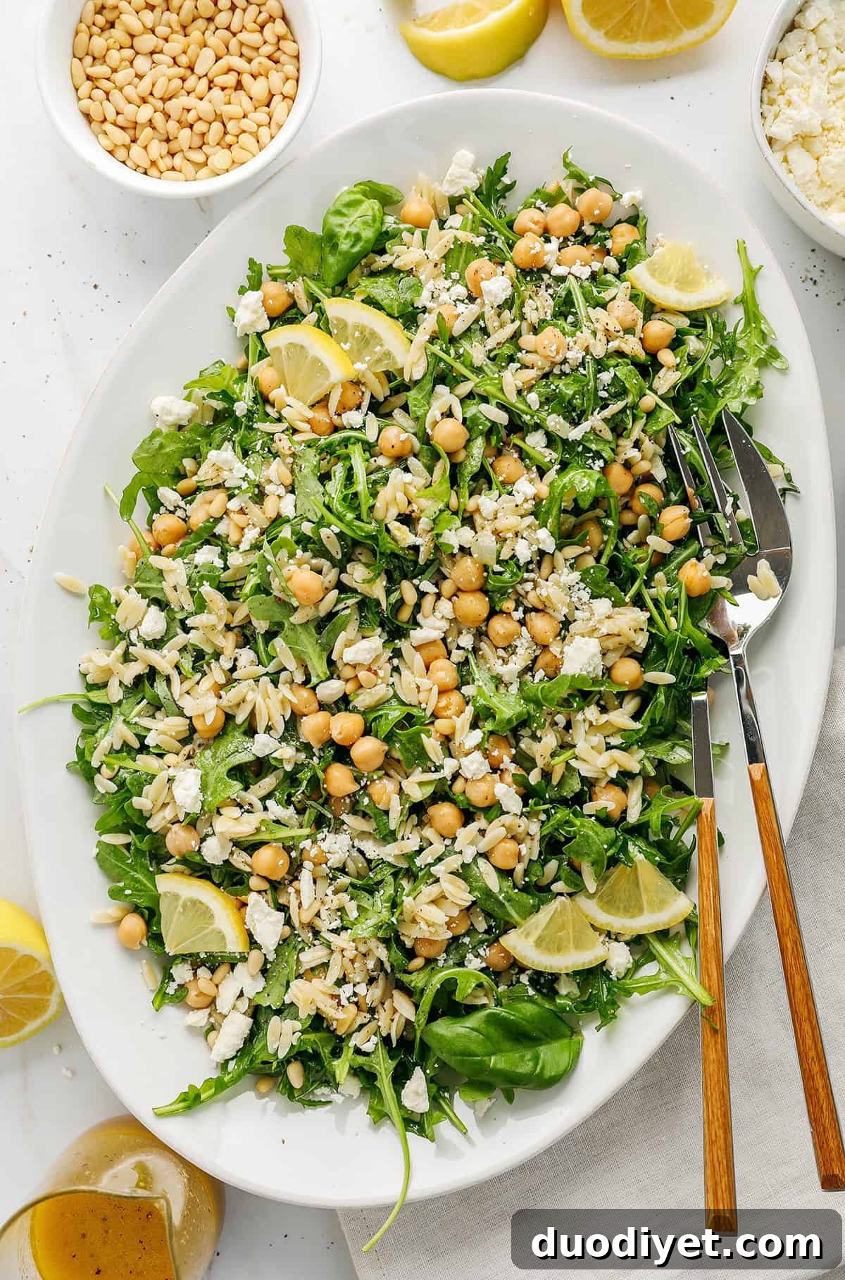Zesty Lemon Arugula Orzo Salad 3 Close-up of Lemon Arugula Orzo Salad with feta and pine nuts