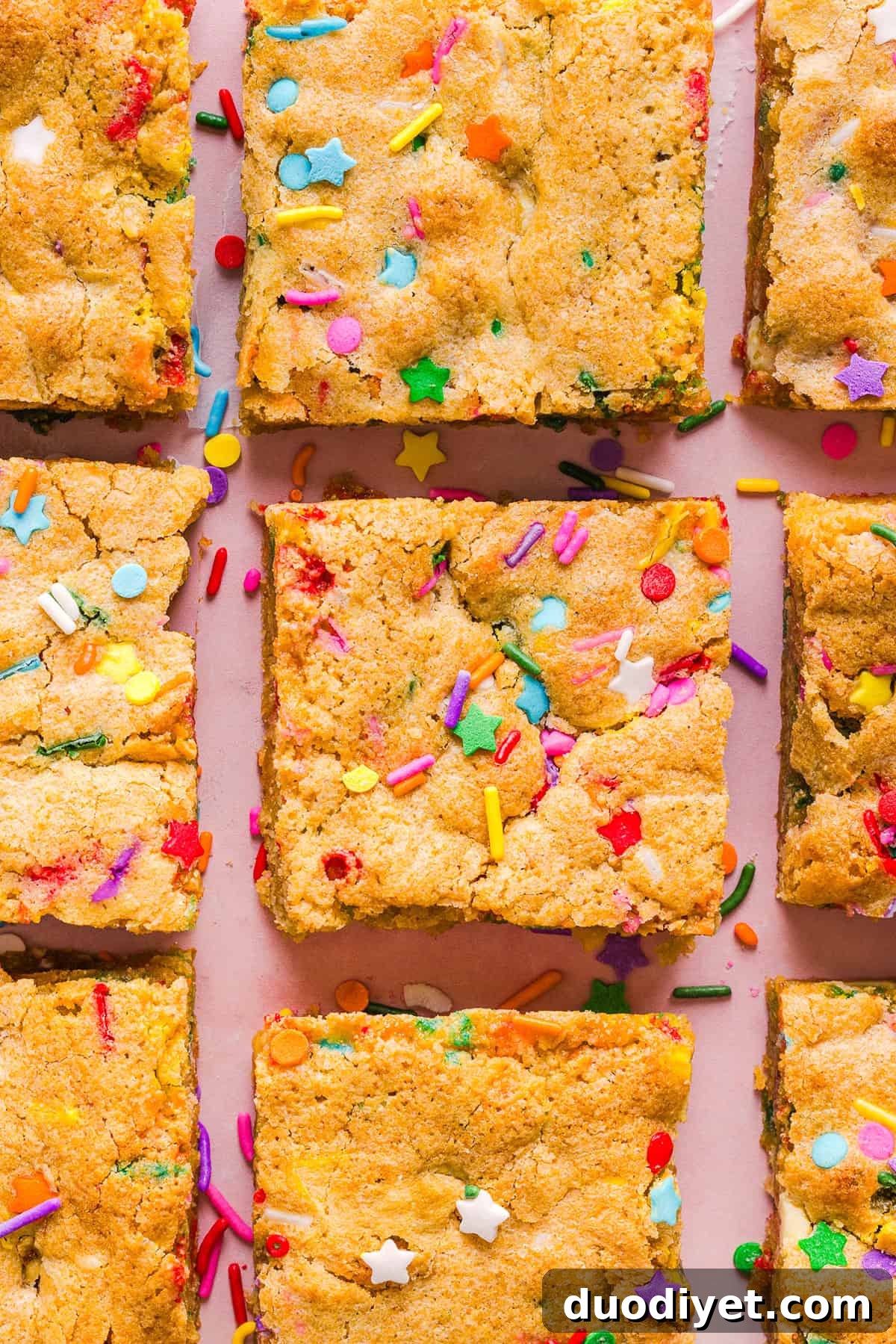 Soft and chewy Healthy Funfetti Cookie Bars that taste like birthday cake batter! Made healthier with whole wheat flour, less butter and zero refined sugar for the perfect lightened-up party dessert!