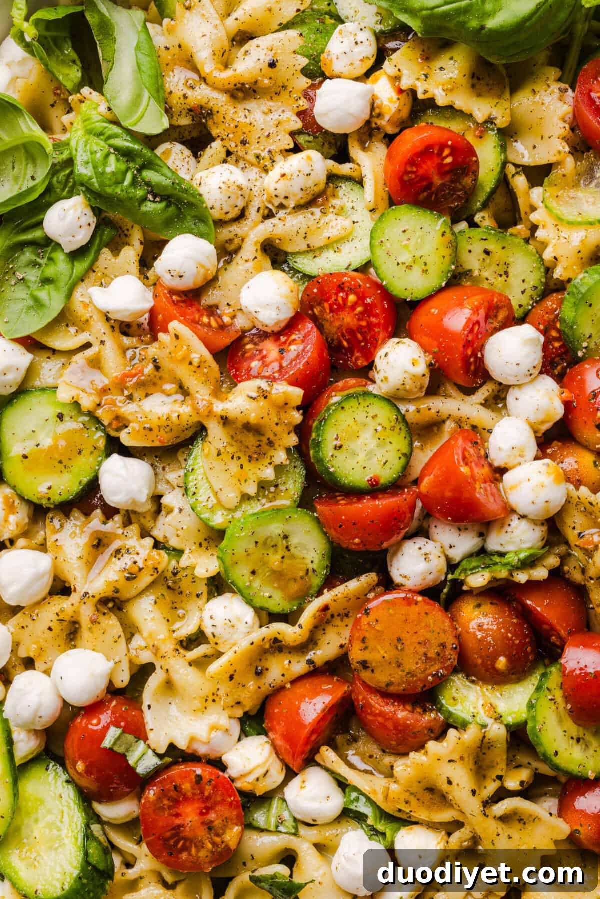 Bowl with fresh basil and mozzarella pearls
