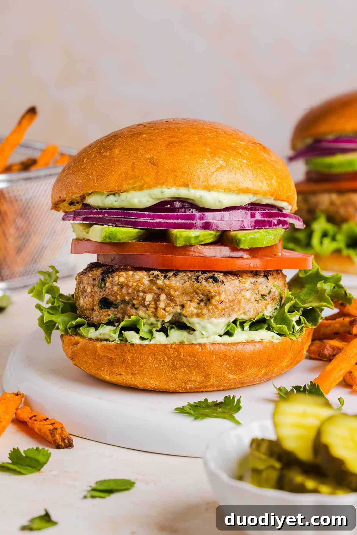 Grilled Cilantro Lime Chicken Burgers 2 These Cilantro Lime Chicken Burgers are juicy, flavorful, and topped with a creamy avocado cilantro sauce. Made with lean ground chicken, fresh cilantro, green onions, and lime zest, these burgers are perfect for summer grilling or an easy weeknight meal!