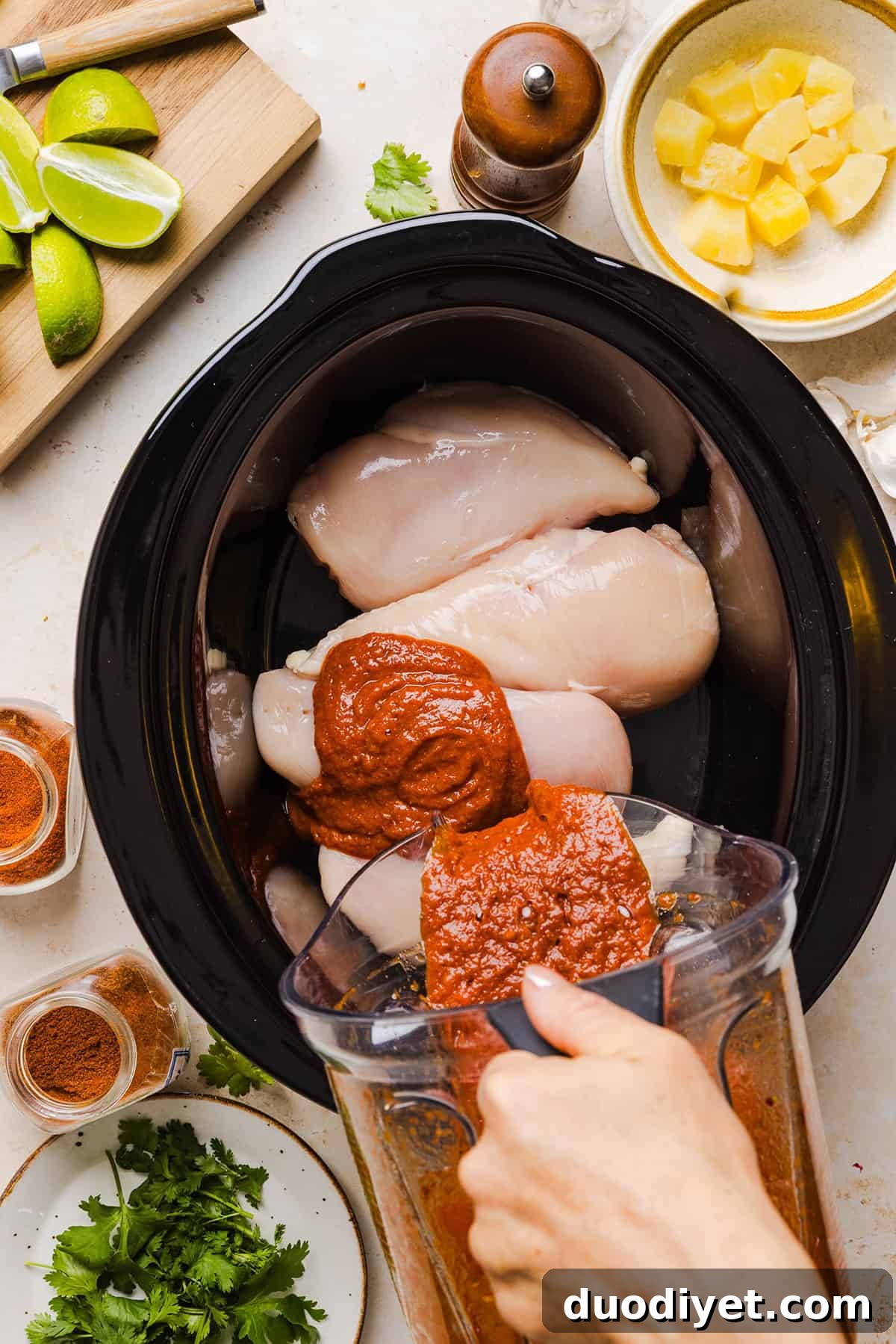 These Crock Pot Chicken Al Pastor Tacos are sweet, smoky, and incredibly flavorful! An easy slow cooker dinner made with juicy shredded chicken, fresh pineapple, chipotle peppers, and warm spices for a healthy, protein-packed dinner.