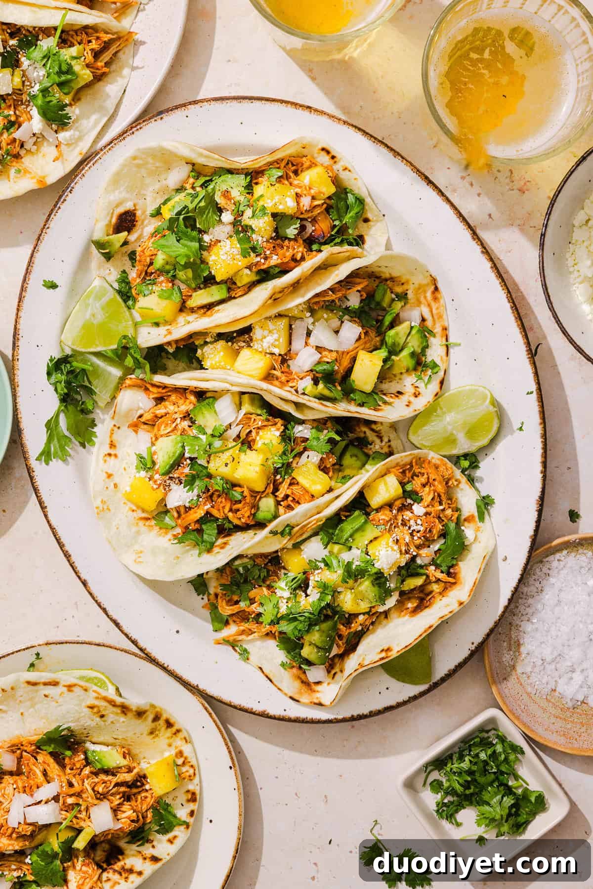 These Crock Pot Chicken Al Pastor Tacos are sweet, smoky, and incredibly flavorful! An easy slow cooker dinner made with juicy shredded chicken, fresh pineapple, chipotle peppers, and warm spices for a healthy, protein-packed dinner.