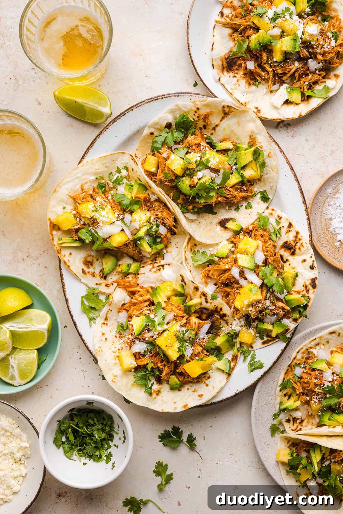 These Crock Pot Chicken Al Pastor Tacos are sweet, smoky, and incredibly flavorful! An easy slow cooker dinner made with juicy shredded chicken, fresh pineapple, chipotle peppers, and warm spices for a healthy, protein-packed dinner.