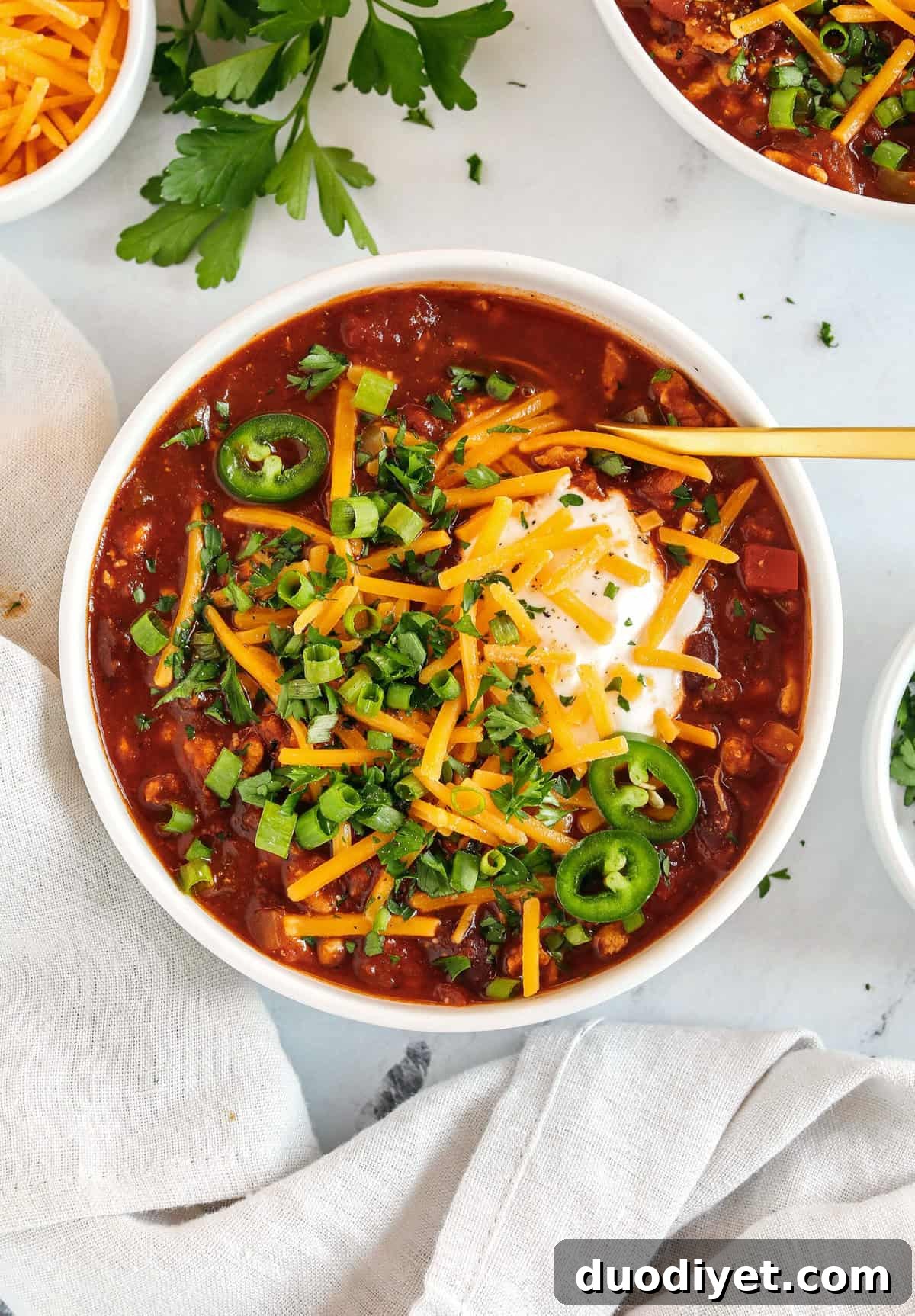 The BEST Healthy Turkey Chili recipe full of fresh veggies, lean ground turkey and loaded with flavor! The perfect cozy chili you can easily make in our instant pot, crock pot or right on the stove!