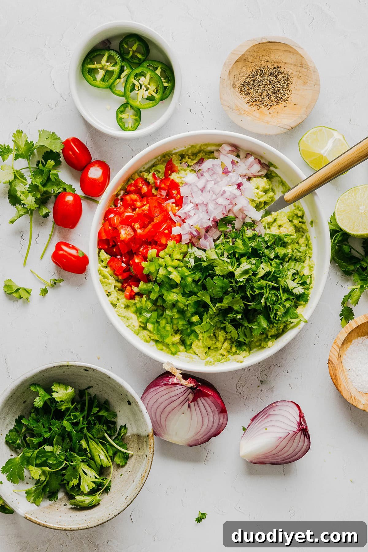 Chunky Guacamole Recipe with Tomato and Onion 4 Fresh ingredients for guacamole.