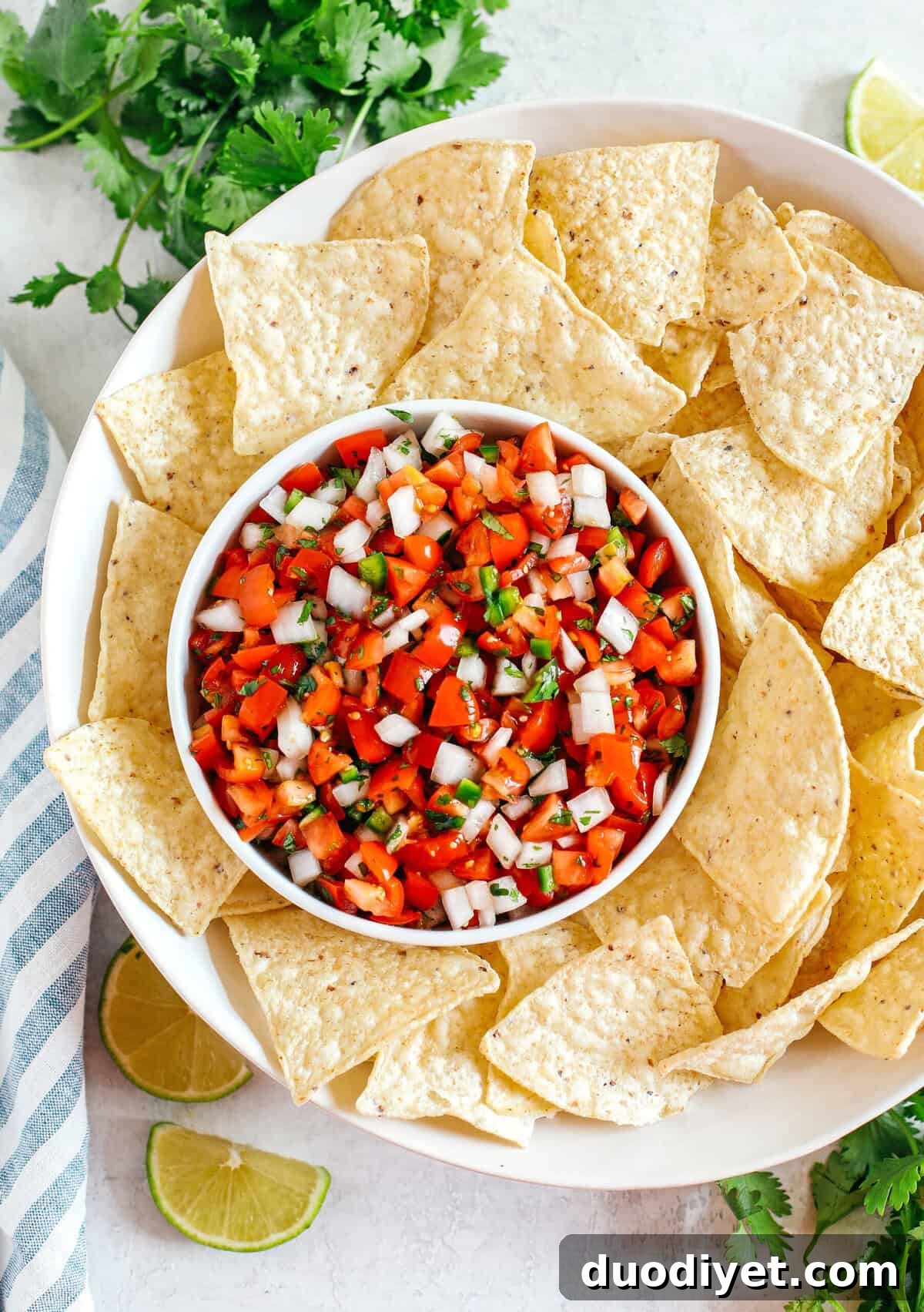 Fresh Homemade Pico De Gallo made with just a few simple ingredients for the perfect flavor boost to any healthy meal or serve as a delicious salsa with chips!