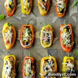 Quinoa stuffed mini peppers on a baking sheet