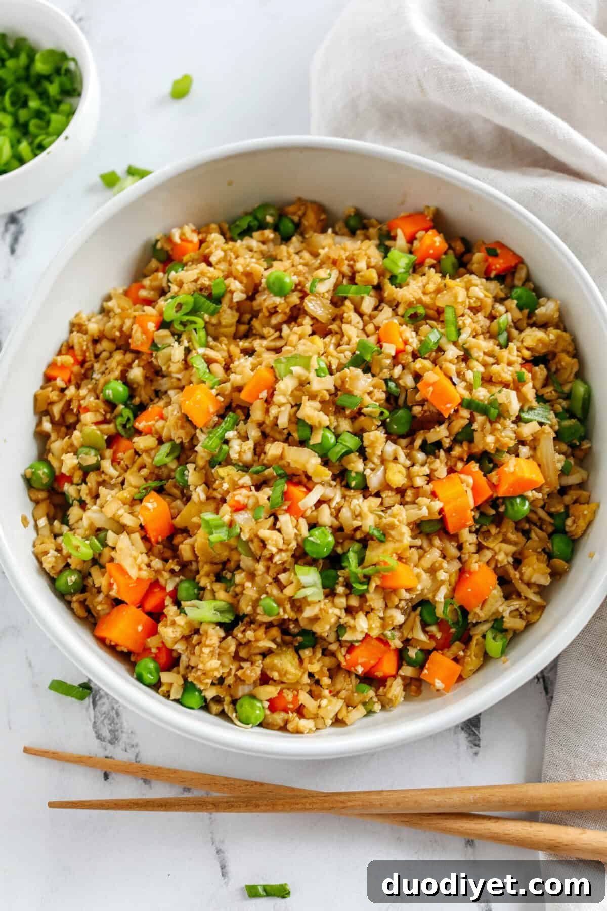 Low Carb Cauliflower Fried Rice Recipe 5 Skip the takeout and enjoy this Healthy Cauliflower Fried Rice in just 15 minutes! Packed with veggies, low in carbs and can be served as a delicious side dish or a main dish with added protein!