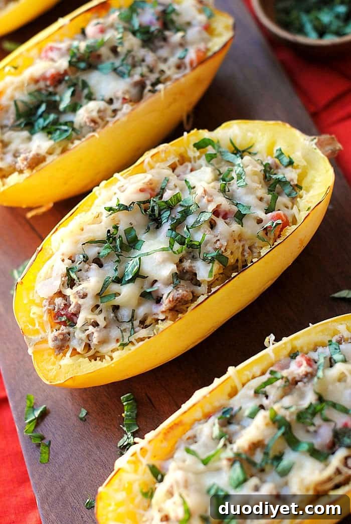 Spaghetti squash boats filled with spicy turkey sausage and melted mozzarella