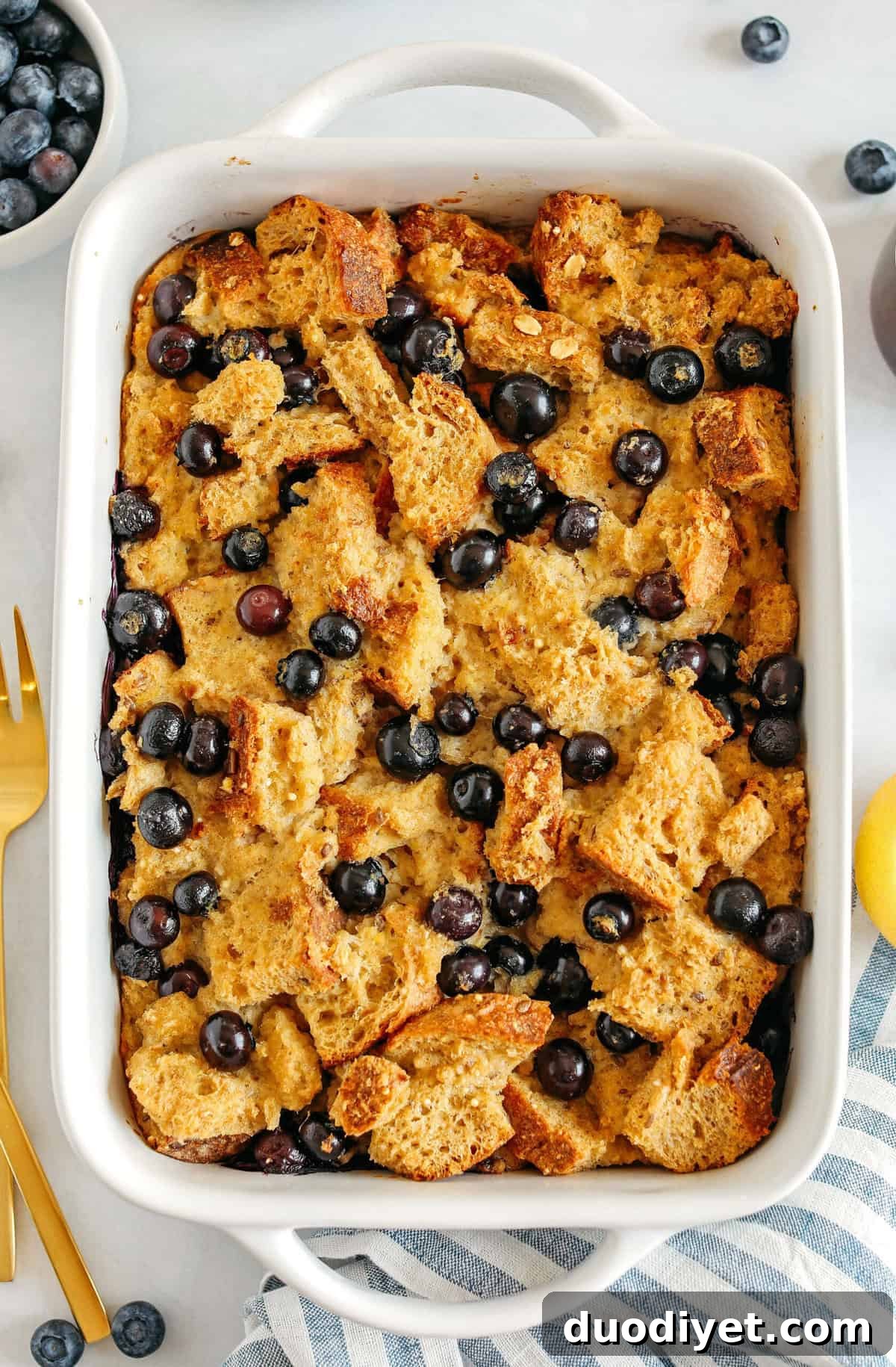 Warm and delicious Blueberry Lemon Bread Pudding lightened up with healthier ingredients and zero butter or refined sugar! The perfect cozy dish for breakfast, brunch or dessert!