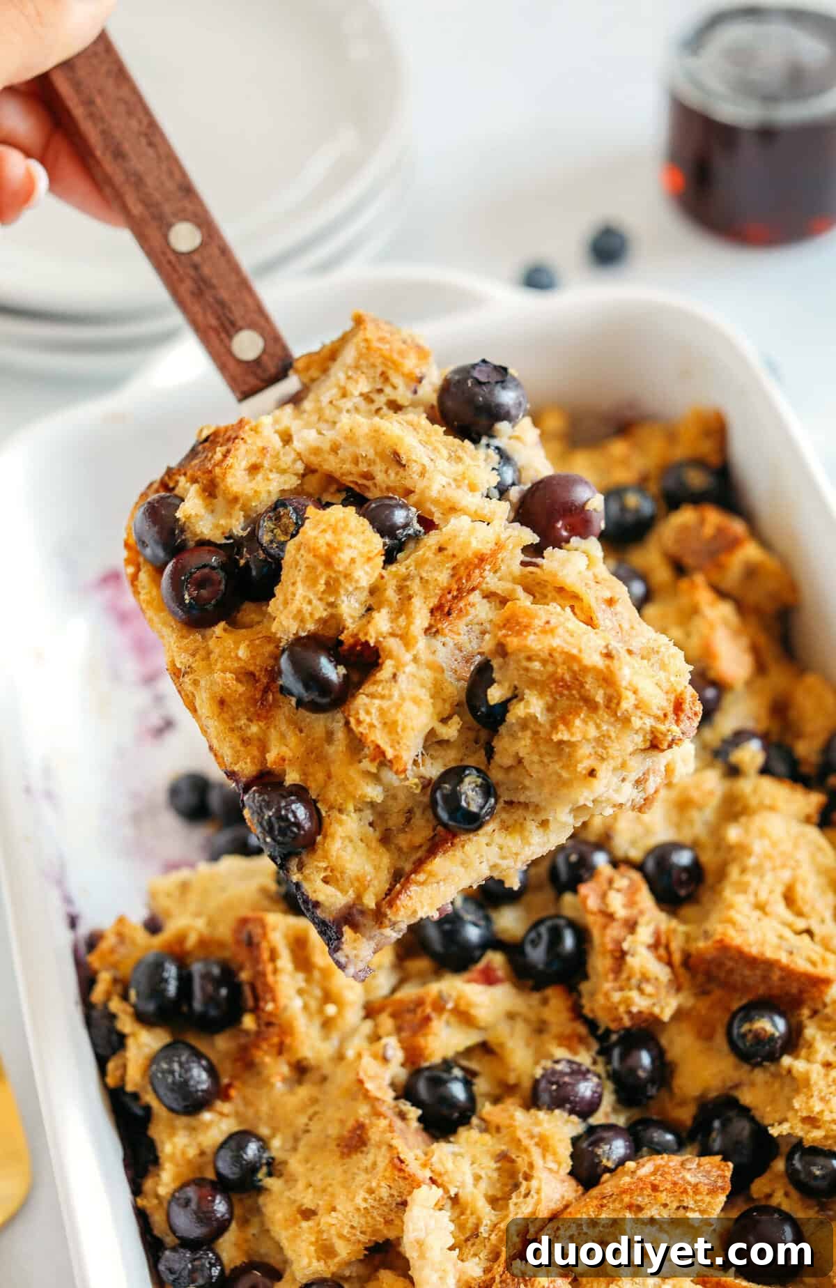 Blueberry Lemon Bread Pudding served warm with golden top