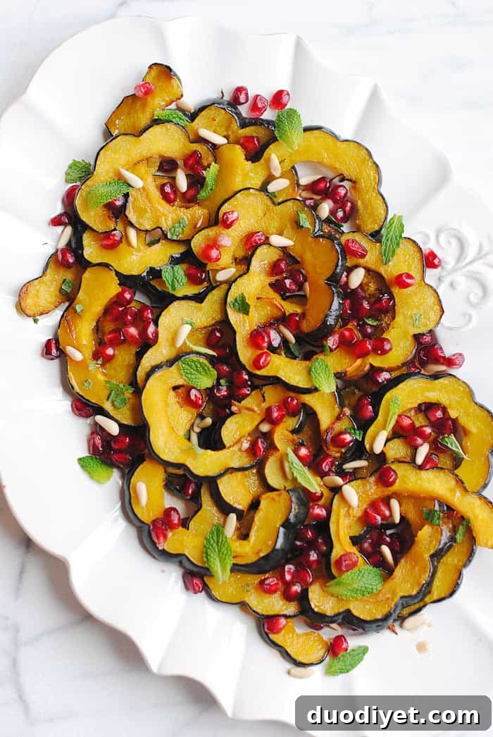 Cinnamon Maple Glazed Acorn Squash for the Holidays 3 Roasted acorn squash slices topped with pomegranate and pine nuts