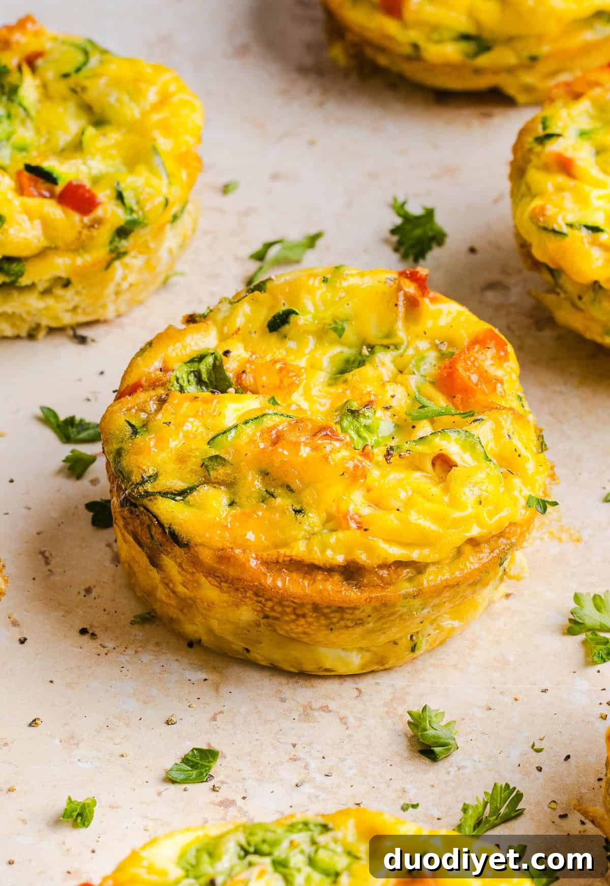 These Healthy Veggie Egg Muffins are an easy, protein-packed breakfast made with eggs, zucchini, bell peppers, onion, arugula and parmesan cheese. These healthy egg muffins are fluffy, flavorful and perfect for meal prep and busy mornings!