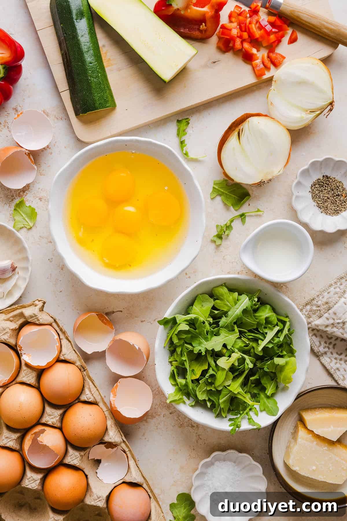 These Healthy Veggie Egg Muffins are an easy, protein-packed breakfast made with eggs, zucchini, bell peppers, onion, arugula and parmesan cheese. These healthy egg muffins are fluffy, flavorful and perfect for meal prep and busy mornings!