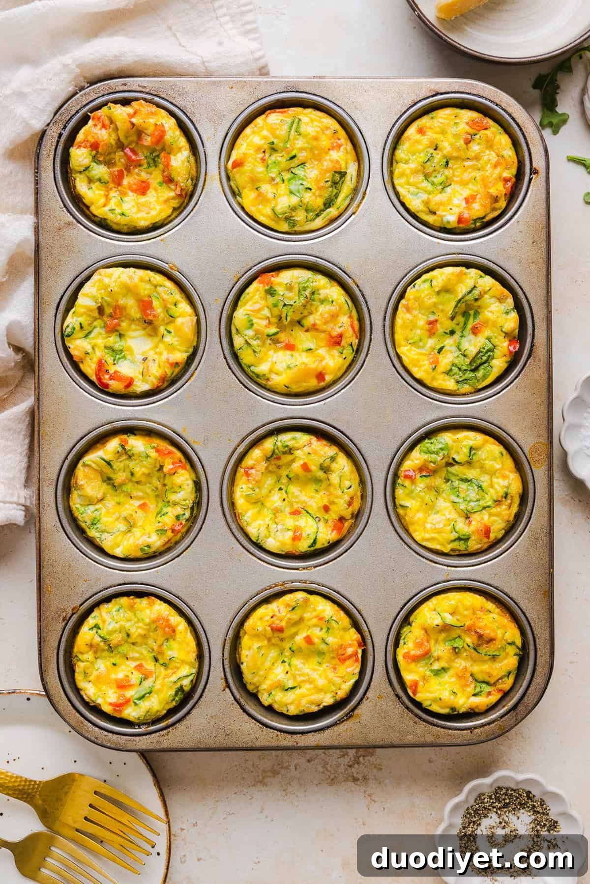Vegetable Egg Muffins for Breakfast and Meal Prep 5 Baked veggie egg muffins cooling on a rack