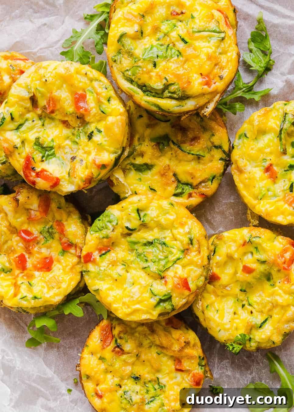 These Healthy Veggie Egg Muffins are an easy, protein-packed breakfast made with eggs, zucchini, bell peppers, onion, arugula and parmesan cheese. These healthy egg muffins are fluffy, flavorful and perfect for meal prep and busy mornings!