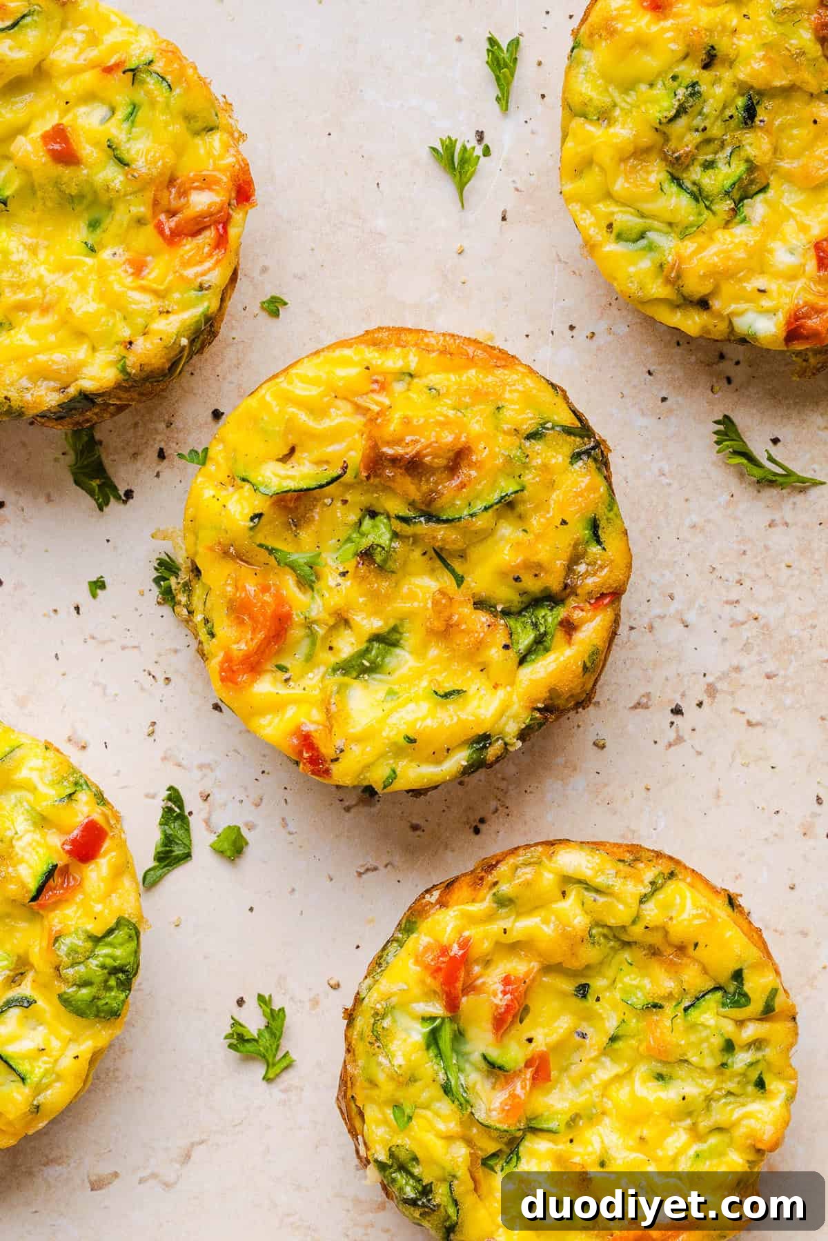 These Healthy Veggie Egg Muffins are an easy, protein-packed breakfast made with eggs, zucchini, bell peppers, onion, arugula and parmesan cheese. These healthy egg muffins are fluffy, flavorful and perfect for meal prep and busy mornings!