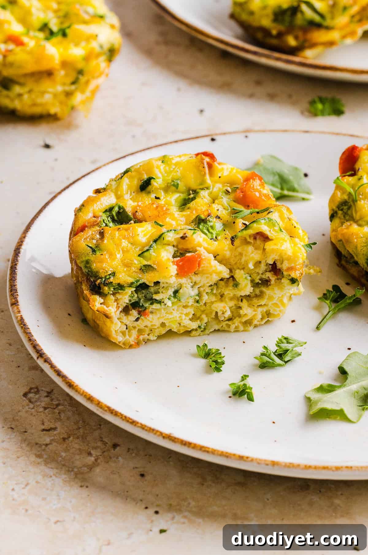 These Healthy Veggie Egg Muffins are an easy, protein-packed breakfast made with eggs, zucchini, bell peppers, onion, arugula and parmesan cheese. These healthy egg muffins are fluffy, flavorful and perfect for meal prep and busy mornings!
