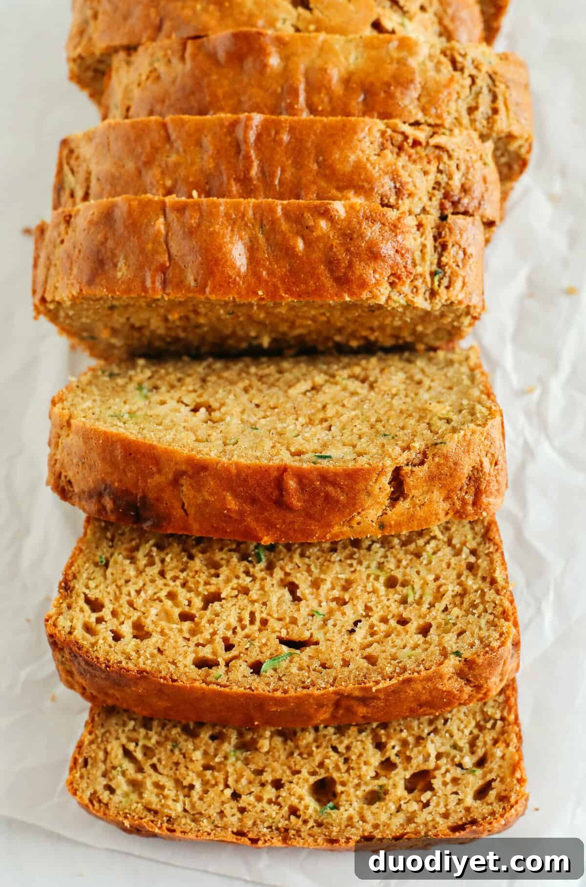 This Healthy Zucchini Bread is moist, fluffy, and made healthier with whole wheat flour, Greek yogurt, shredded zucchini and zero butter or refined sugar.  Perfect for breakfast or an easy snack!