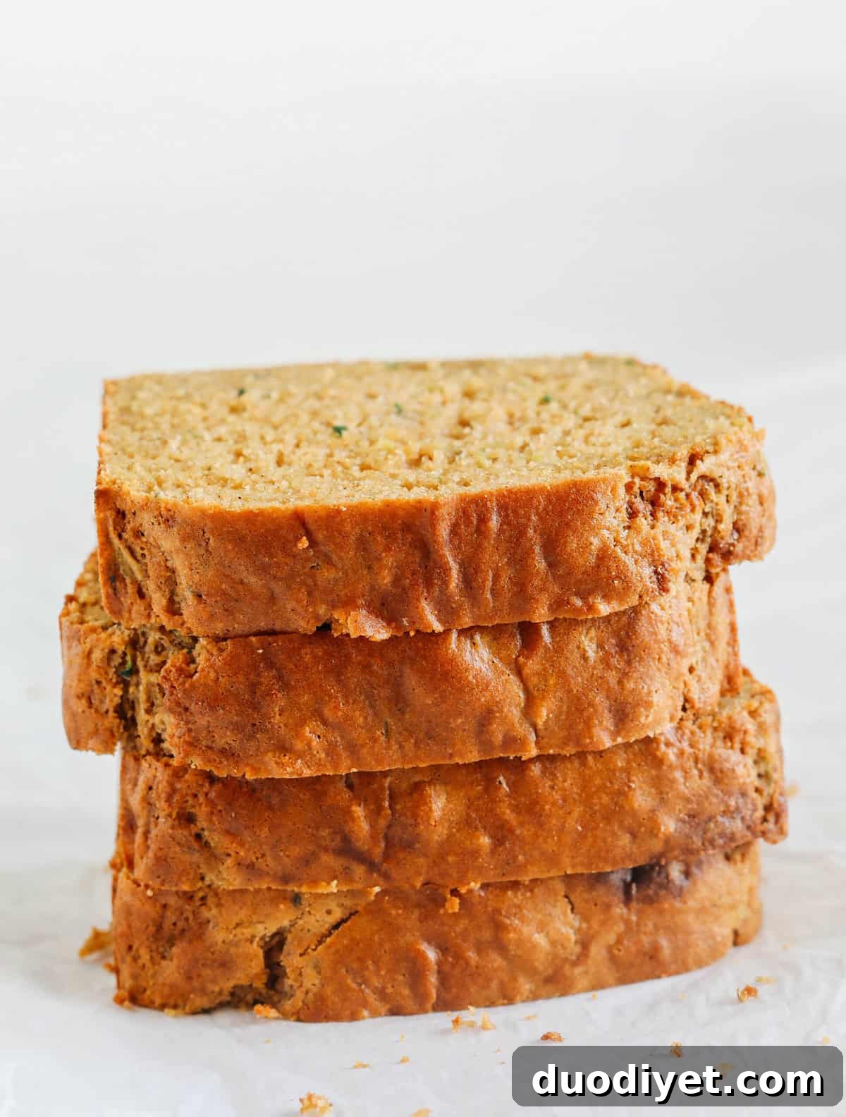 This Healthy Zucchini Bread is moist, fluffy, and made healthier with whole wheat flour, Greek yogurt, shredded zucchini and zero butter or refined sugar.  Perfect for breakfast or an easy snack!