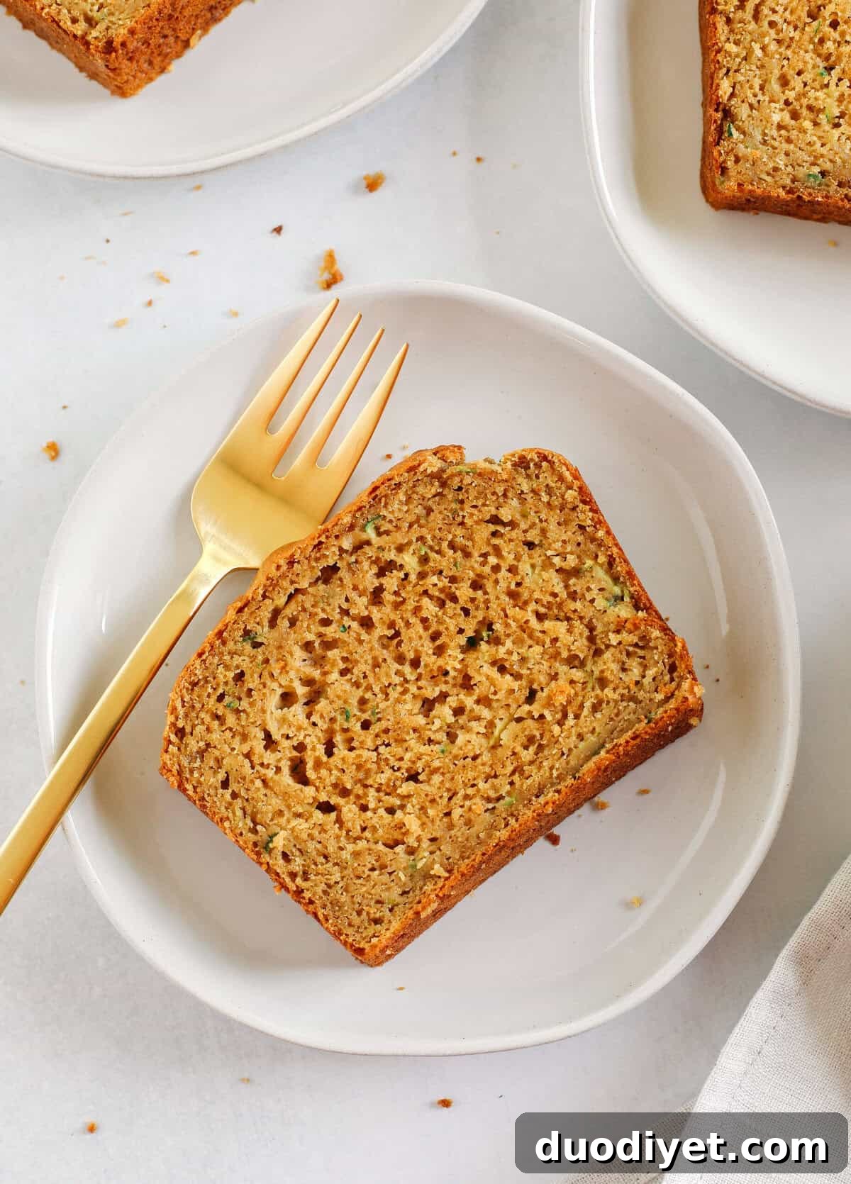 This Healthy Zucchini Bread is moist, fluffy, and made healthier with whole wheat flour, Greek yogurt, shredded zucchini and zero butter or refined sugar.  Perfect for breakfast or an easy snack!
