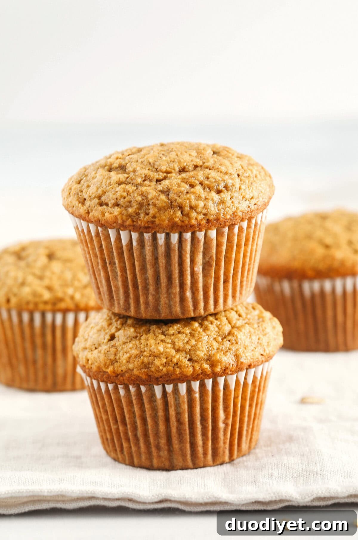 Moist Banana Bran Muffins Recipe 3 Baked banana bran muffins cooling on a rack
