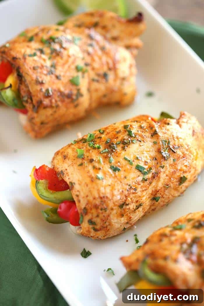 Oven-Baked Cheesy Chicken Fajita Roll-Ups 2 Baked Chicken Fajita Roll-Ups - tender chicken rolled around seasoned bell peppers