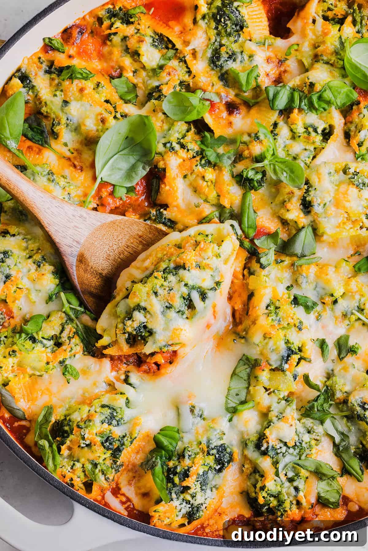 These cozy Veggie and Cheese Stuffed Shells are a family favorite that are loaded with vegetables, easy to freeze and make the perfect weeknight meal! The ultimate comfort food with a healthy twist!