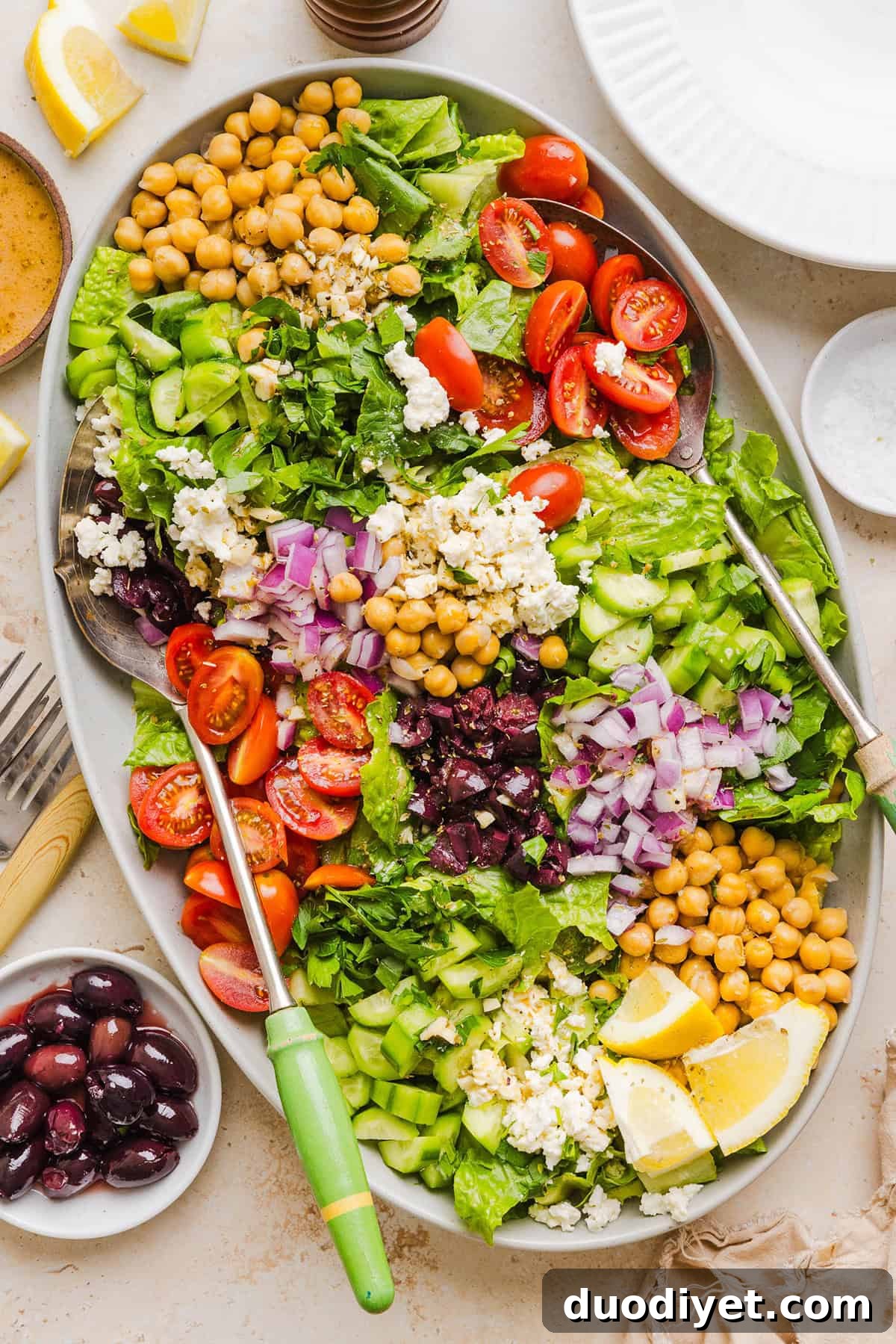 Fresh and crisp Mediterranean Chopped Salad made with fresh tomatoes, crisp cucumbers, red onion, chickpeas, olives and feta cheese all tossed with a delicious red wine vinaigrette! Perfect for meal prep, lunches, or an easy side dish for any meal.