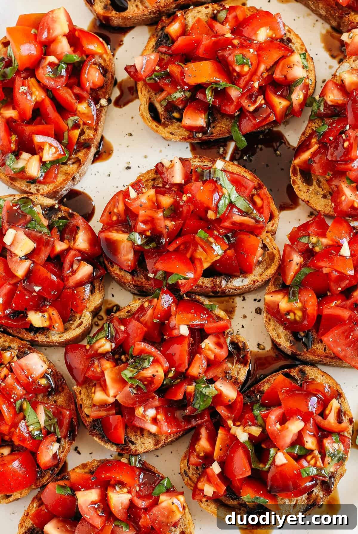 The Easiest Tomato and Basil Bruschetta recipe that is super flavorful, easy to make and such a huge crowdpleaser when entertaining! Made with fresh tomatoes, garlic cloves, rich balsamic vinegar, olive oil and fresh basil. 