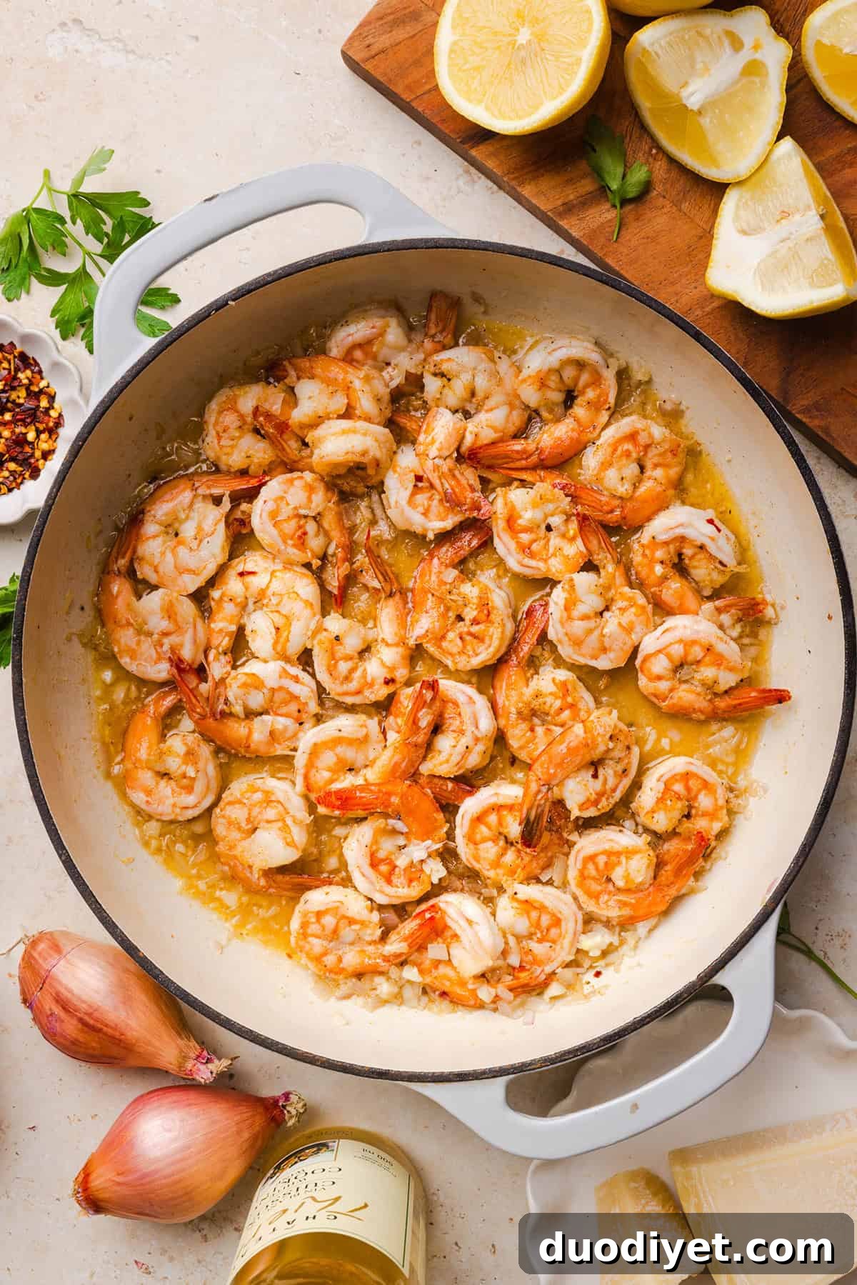 The BEST Healthy Shrimp Scampi recipe lightened up without sacrificing flavor! Juicy shrimp, garlic, lemon, white wine, and Parmesan are tossed with tender linguine in a silky, buttery sauce that’s ready in just 30 minutes.