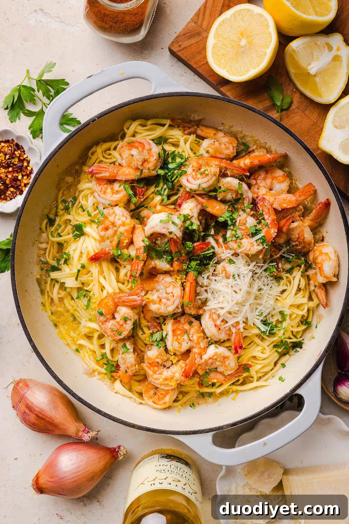 The BEST Healthy Shrimp Scampi recipe lightened up without sacrificing flavor! Juicy shrimp, garlic, lemon, white wine, and Parmesan are tossed with tender linguine in a silky, buttery sauce that’s ready in just 30 minutes.