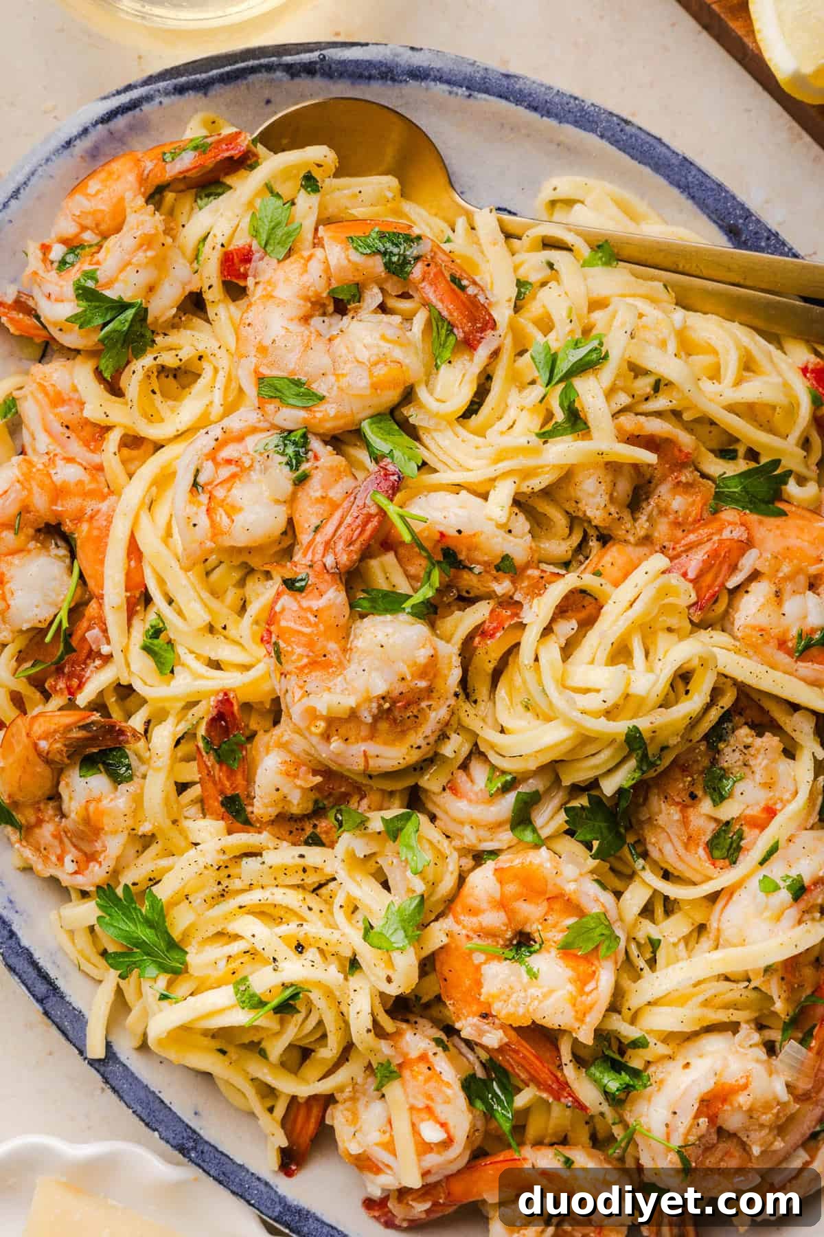The BEST Healthy Shrimp Scampi recipe lightened up without sacrificing flavor! Juicy shrimp, garlic, lemon, white wine, and Parmesan are tossed with tender linguine in a silky, buttery sauce that’s ready in just 30 minutes.