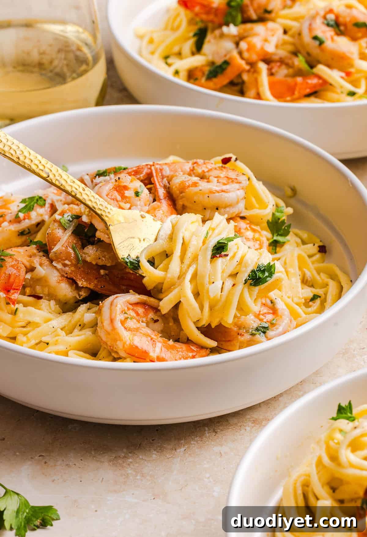 The BEST Healthy Shrimp Scampi recipe lightened up without sacrificing flavor! Juicy shrimp, garlic, lemon, white wine, and Parmesan are tossed with tender linguine in a silky, buttery sauce that’s ready in just 30 minutes.