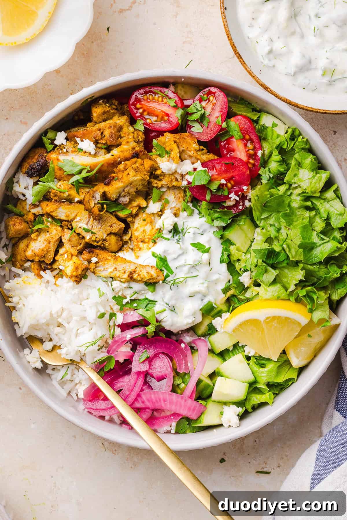 These Easy Chicken Shawarma Bowls are loaded with juicy spiced chicken, fluffy rice, fresh veggies, feta and creamy homemade tzatziki! A healthy, flavor-packed meal that is great for meal prep!