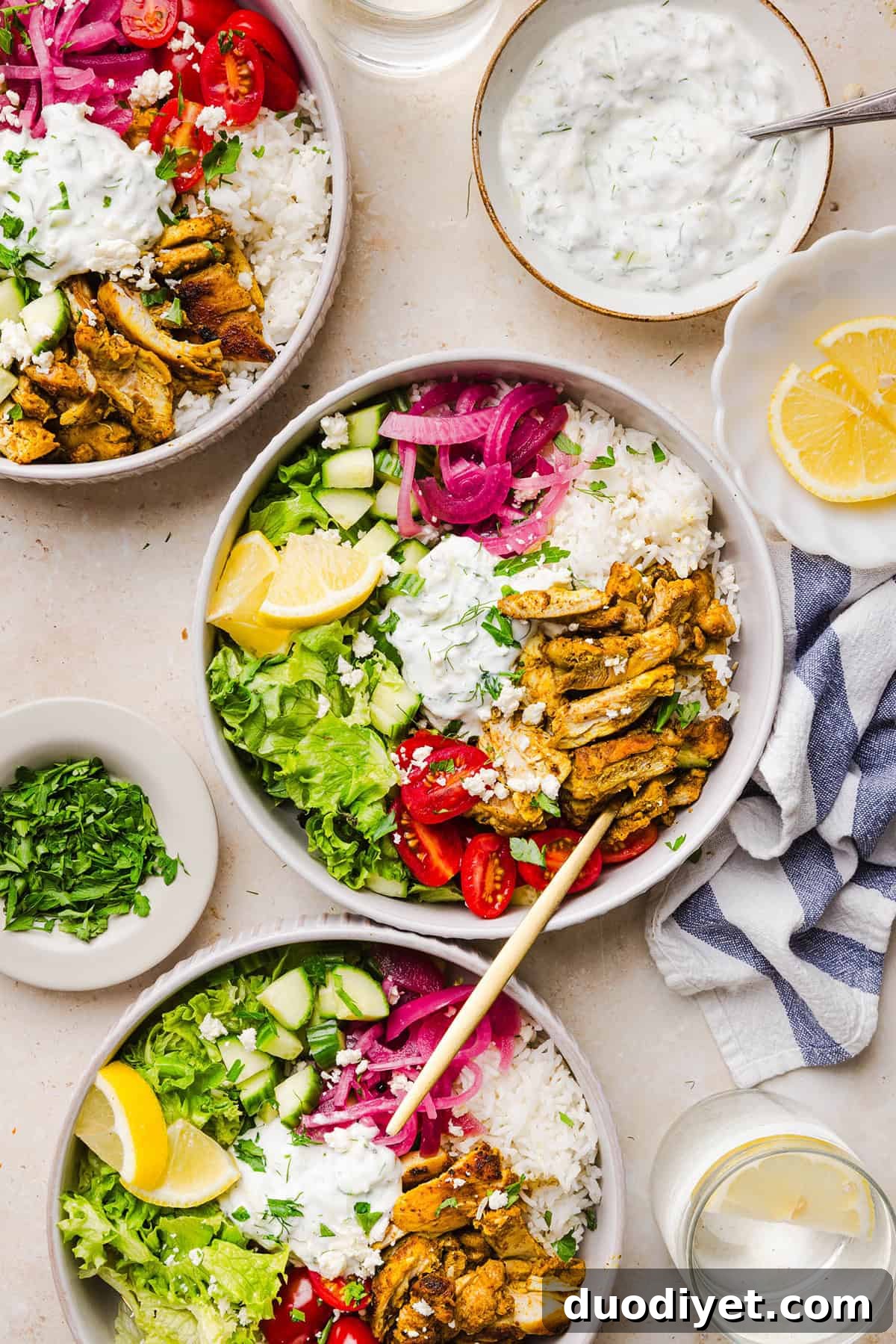 These Easy Chicken Shawarma Bowls are loaded with juicy spiced chicken, fluffy rice, fresh veggies, feta and creamy homemade tzatziki! A healthy, flavor-packed meal that is great for meal prep!