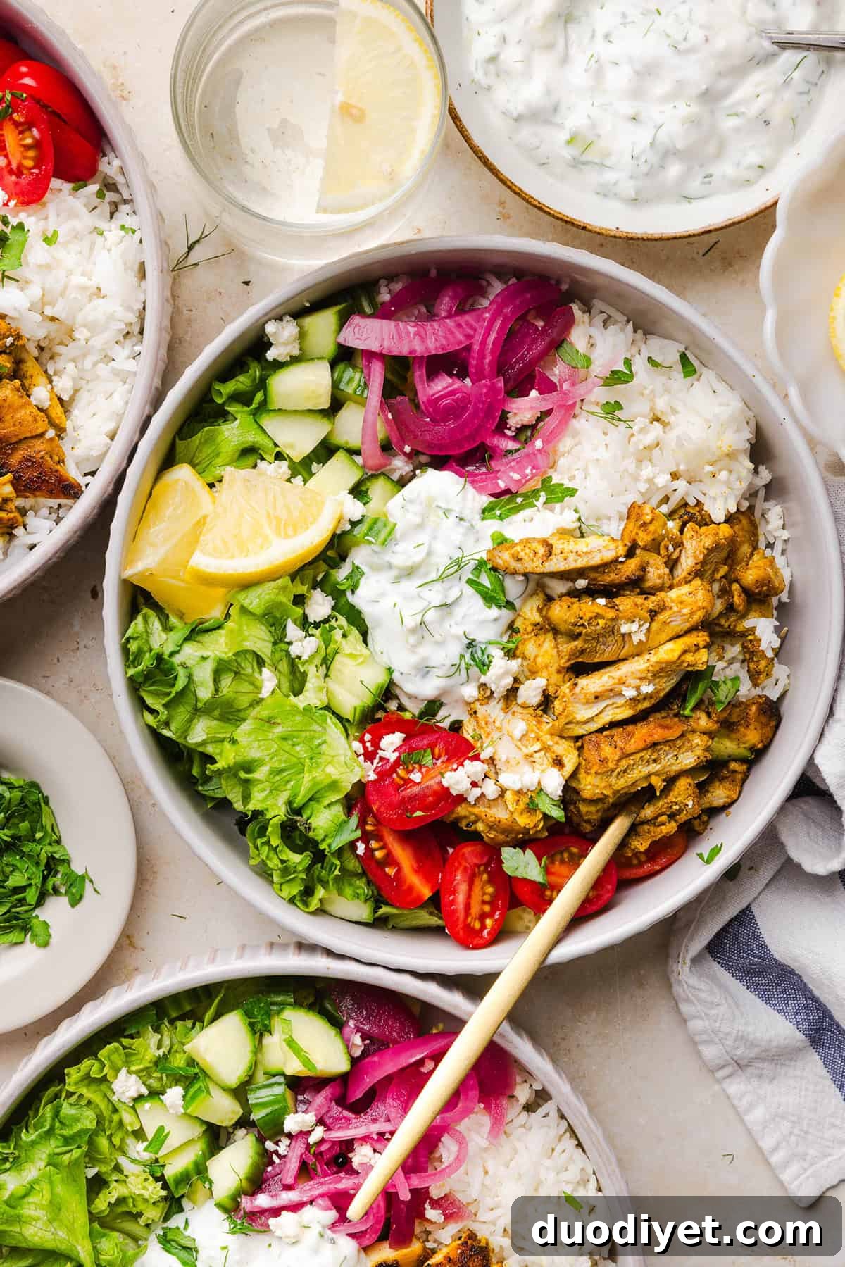 These Easy Chicken Shawarma Bowls are loaded with juicy spiced chicken, fluffy rice, fresh veggies, feta and creamy homemade tzatziki! A healthy, flavor-packed meal that is great for meal prep!