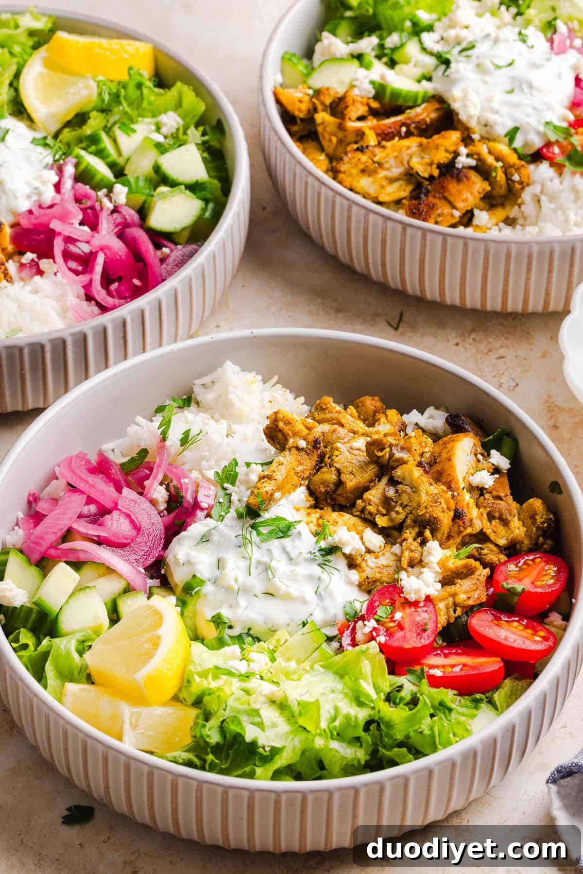 These Easy Chicken Shawarma Bowls are loaded with juicy spiced chicken, fluffy rice, fresh veggies, feta and creamy homemade tzatziki! A healthy, flavor-packed meal that is great for meal prep!