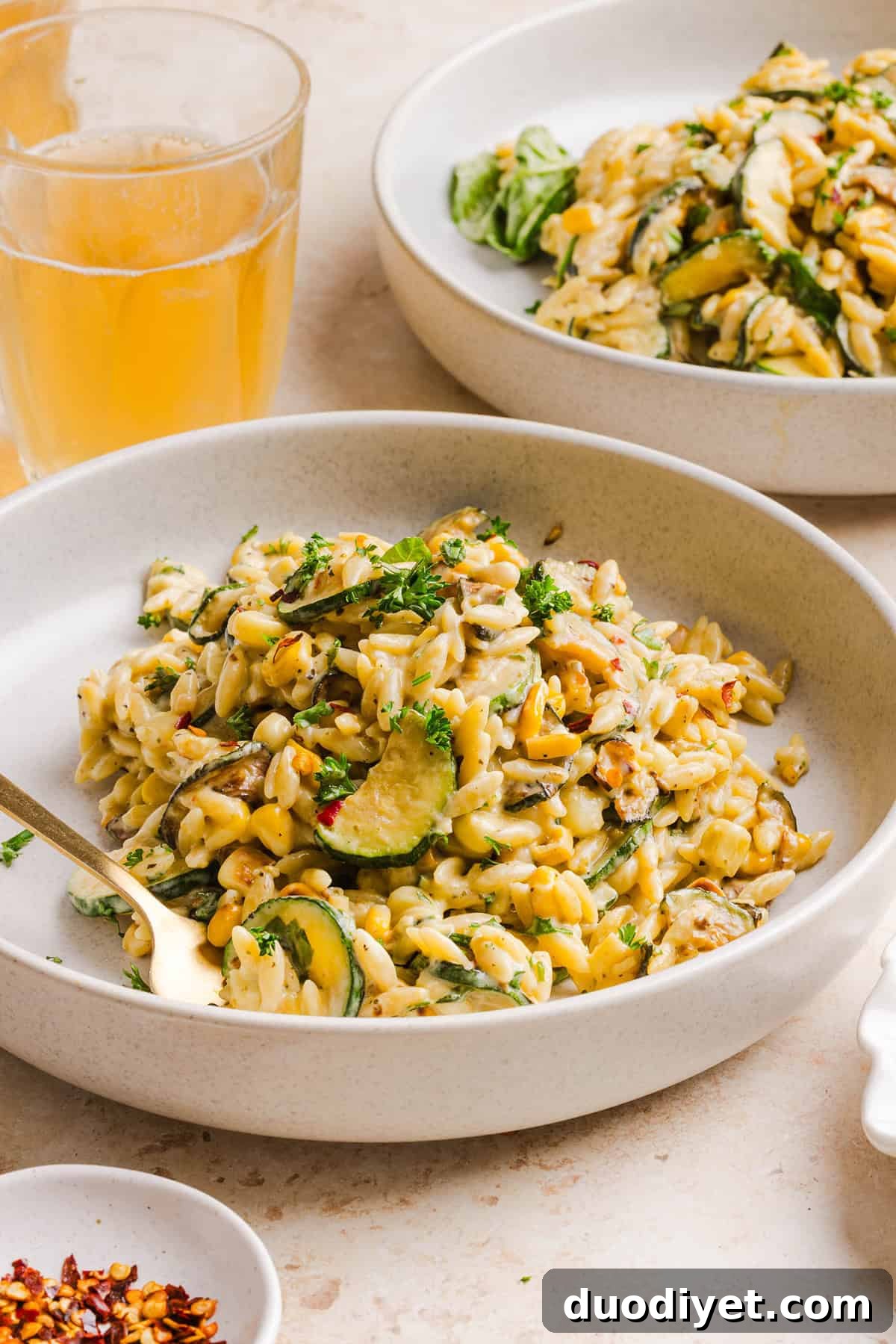 This creamy One Pan Lemon Garlic Orzo with Zucchini and Corn is fresh, flavorful and made in one skillet for an easy summer side dish or weeknight meal. Packed with fresh veggies, tender orzo, Parmesan, herbs and bright lemon flavor!