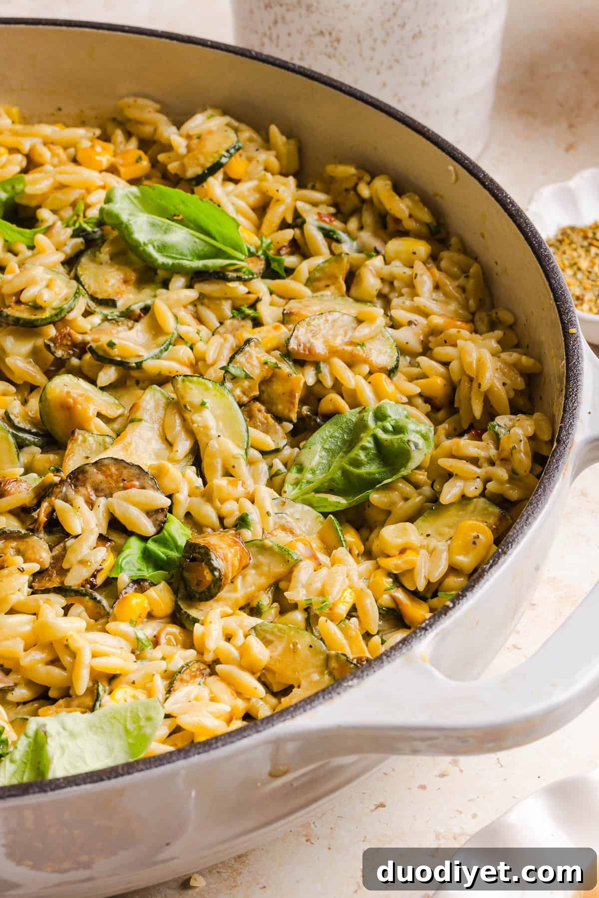 This creamy One Pan Lemon Garlic Orzo with Zucchini and Corn is fresh, flavorful and made in one skillet for an easy summer side dish or weeknight meal. Packed with fresh veggies, tender orzo, Parmesan, herbs and bright lemon flavor!